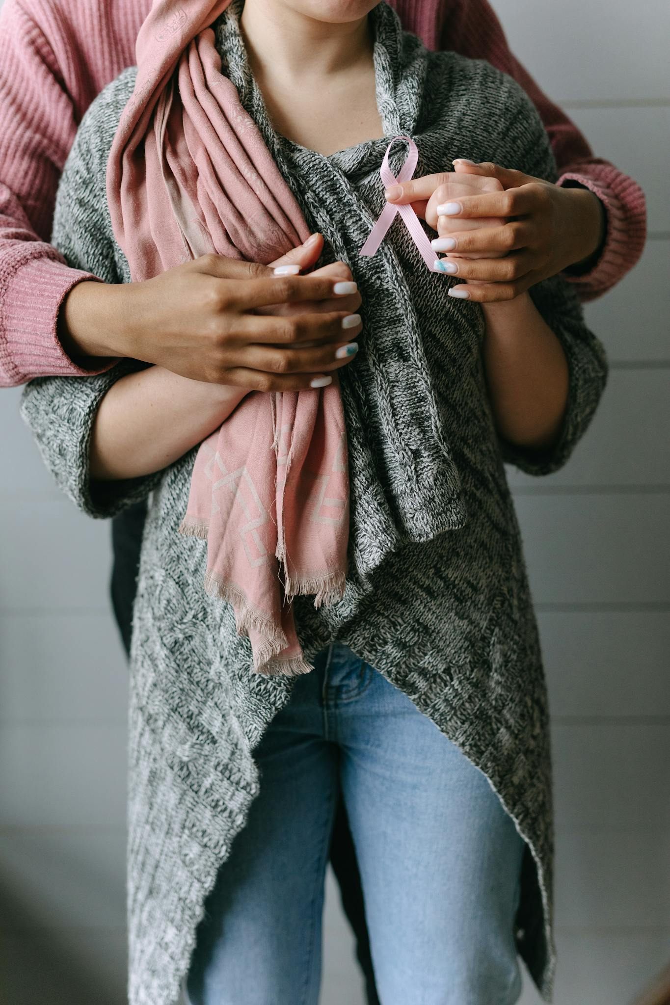 A heartfelt embrace symbolizing support and awareness for breast cancer patients.